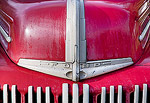 Close-up of the front end of an old Ford pickup truck.