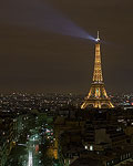 The Eiffel Tower seen from the top of the Arc de Triomphe at night.  Paris, France.