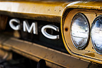 The front of an old rusty school bus.