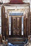 An old weathered front door on a house in Bodie, CA.