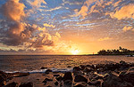 Last glimpse of the sun as it lights up the evening clouds over Kukuiula Bay and the sea spray from Spouting Horn.  Poipu, Kauai.